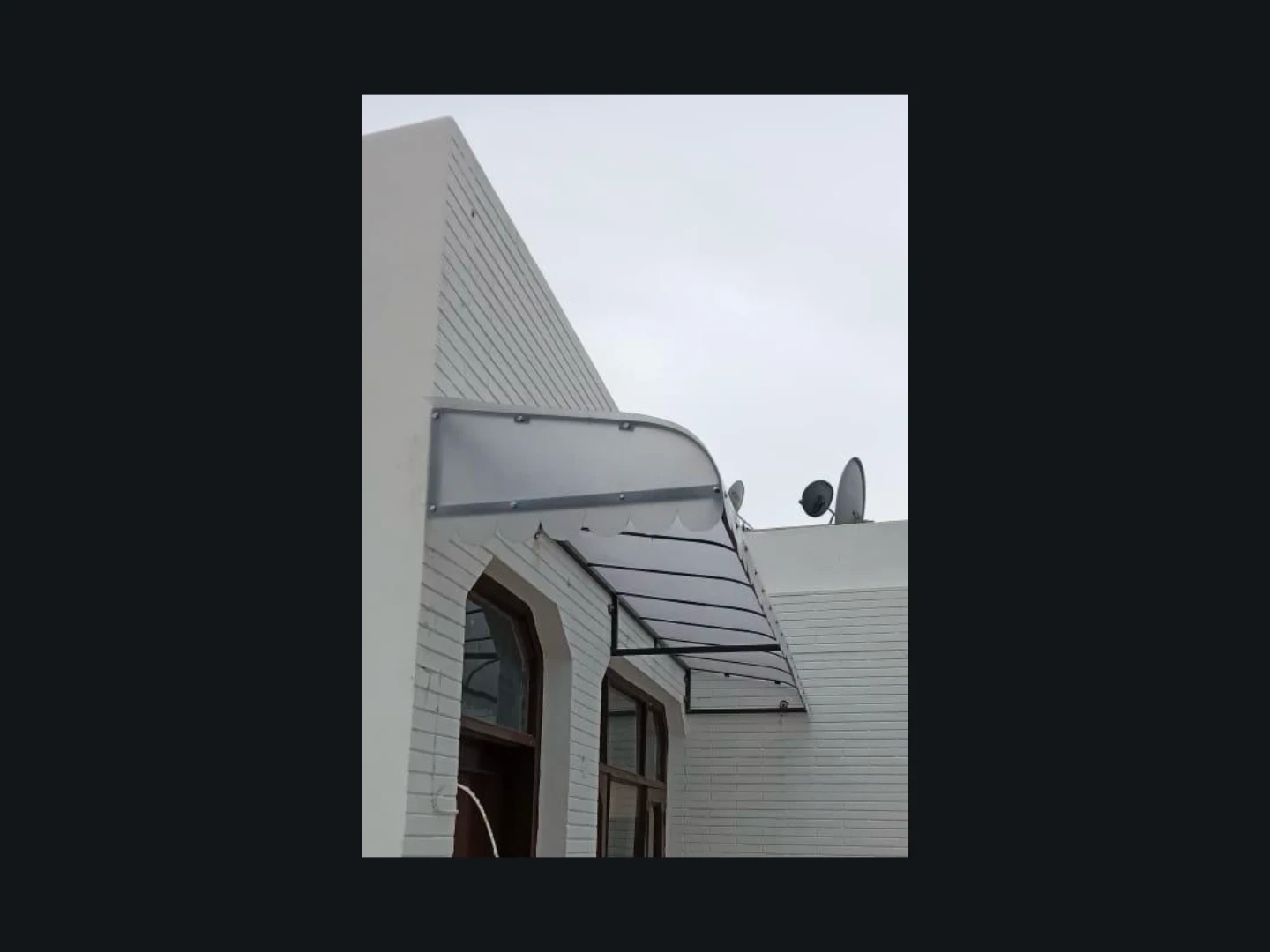 Polycarbonate balcony cover letting daylight through