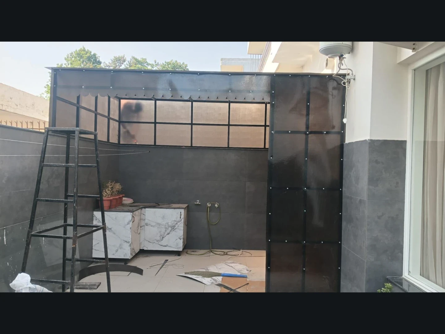 Galvanised GI sheet roofing on a utility structure